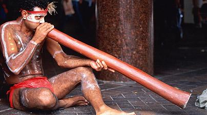 Aborigine with didgeridoo.
